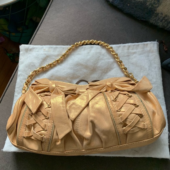 Isabella Fiore Handbags - Isabelle Fiore Gold Leather Lace Up Bows Clutch